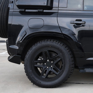 City driving view with installed alloy wheels on Defender