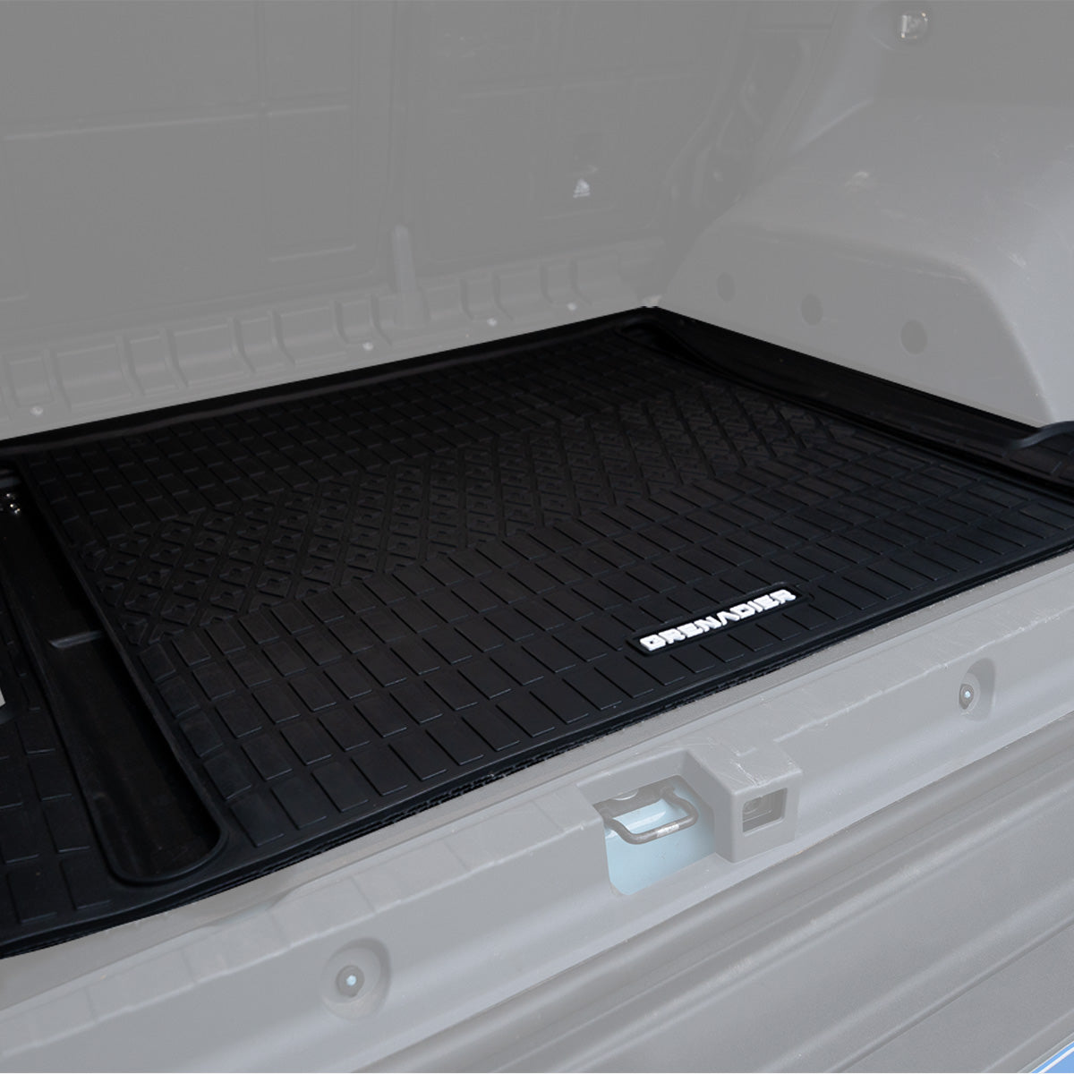PLOMOR TPE cargo liner installed in Ineos Grenadier rear trunk overview