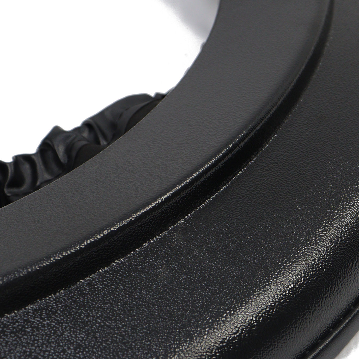 PLOMOR Donut-Style Spare Tire Cover for INEOS Grenadier. Hybrid design with durable ABS outer shell and refined leather inner ring, providing style and UV protection.