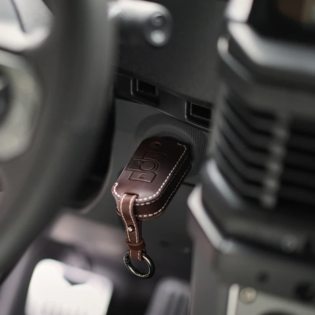 Leather AirTag cover attached to keychain for Ineos Grenadier, secure AirTag holder