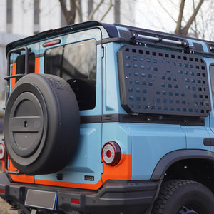 PLOMOR MOLLE side window armor panel for the INEOS Grenadier, powder-coated steel with custom bolt-on fit.