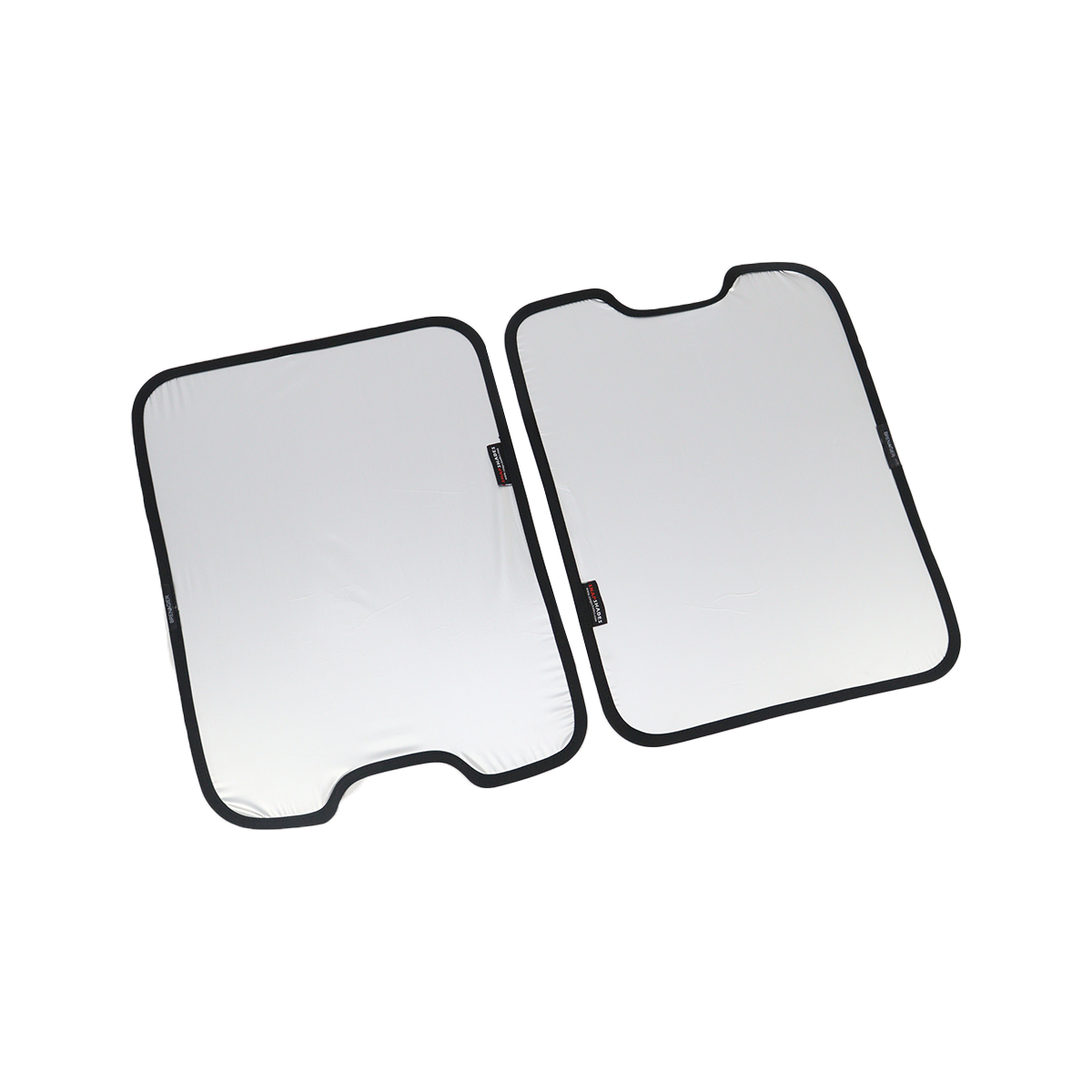 PLOMOR two-piece skylight roof sunshade for INEOS Grenadier, silver reflective side shown, angled layout—left panel with bottom notch, right panel with top notch, on white background