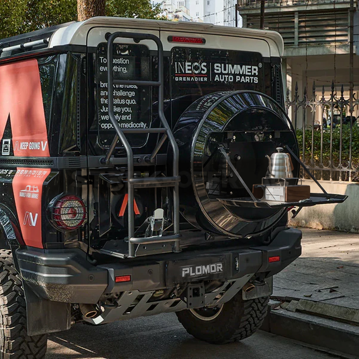 PLOMOR spare wheel storage system installed on INEOS Grenadier rear view