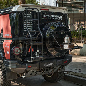 PLOMOR spare wheel storage system installed on INEOS Grenadier rear view