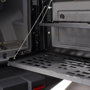 PLOMOR Heavy-Duty Rear Tailgate Folding Table for INEOS Grenadier. Powder-coated steel multi-function platform for overlanding, camping, and stable workspace.