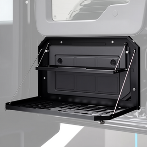 PLOMOR Heavy-Duty Rear Tailgate Folding Table for INEOS Grenadier. Powder-coated steel multi-function platform for overlanding, camping, and stable workspace.