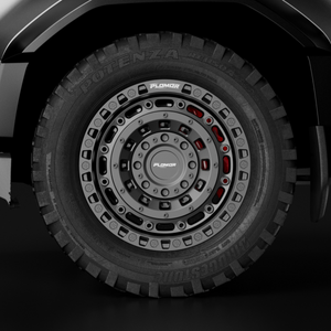 PLOMOR 18-inch forged wheel, beadlock-style — gunmetal with red accents for Toyota Land Cruiser LC250 / 1958, installed close-up
