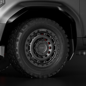 PLOMOR 18-inch forged wheel, beadlock-style — gunmetal with red accents for Toyota Land Cruiser LC250 / 1958, side installed close-up