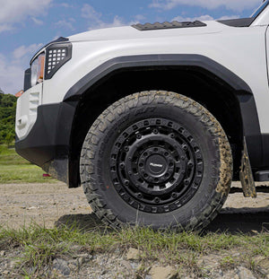 PLOMOR LC250 forged beadlock-style wheel angled view