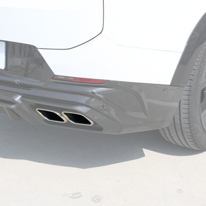 Installed view of chrome dual exhaust tailpipe tip finishers on a Range Rover with a carbon-fiber rear diffuser.