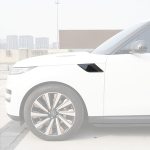 Side view of a Range Rover showing the right-hand fender side vent trim with carbon-fiber look surround and gloss-black insert installed.