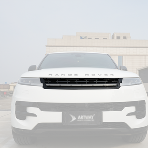 Full front view of a Range Rover featuring a gloss-black front grille with an integrated LED light bar, outdoor daytime scene.