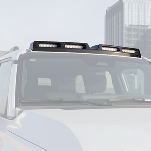 PLOMOR gloss black four-lamp roof lighting cover on Toyota LC250, windscreen top/roofline detail view