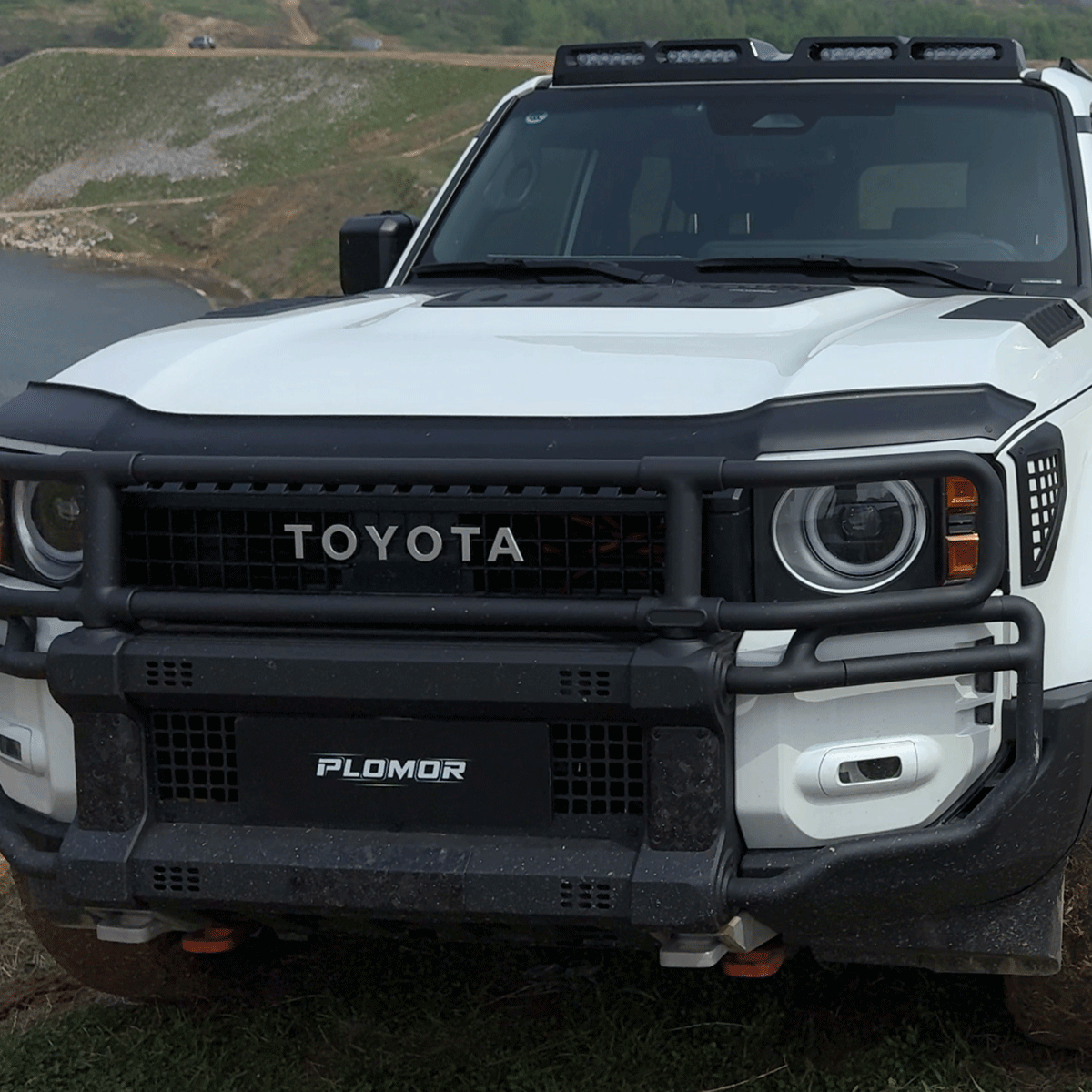 PLOMOR front lip spoiler for Toyota Land Cruiser LC250 2024-2026 with black PP finish