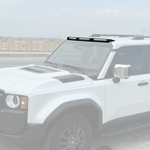 PLOMOR gloss black ABS triple roof lighting cover on Toyota LC250, on-vehicle side profile in outdoor scene