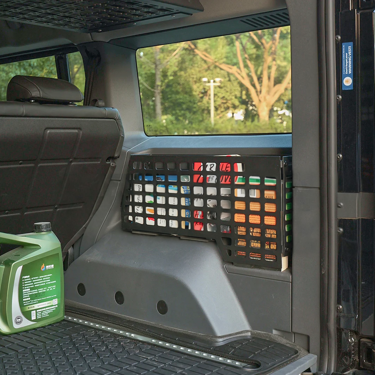 plomor INEOS Grenadier trunk side MOLLE organizer installed rear boot storage