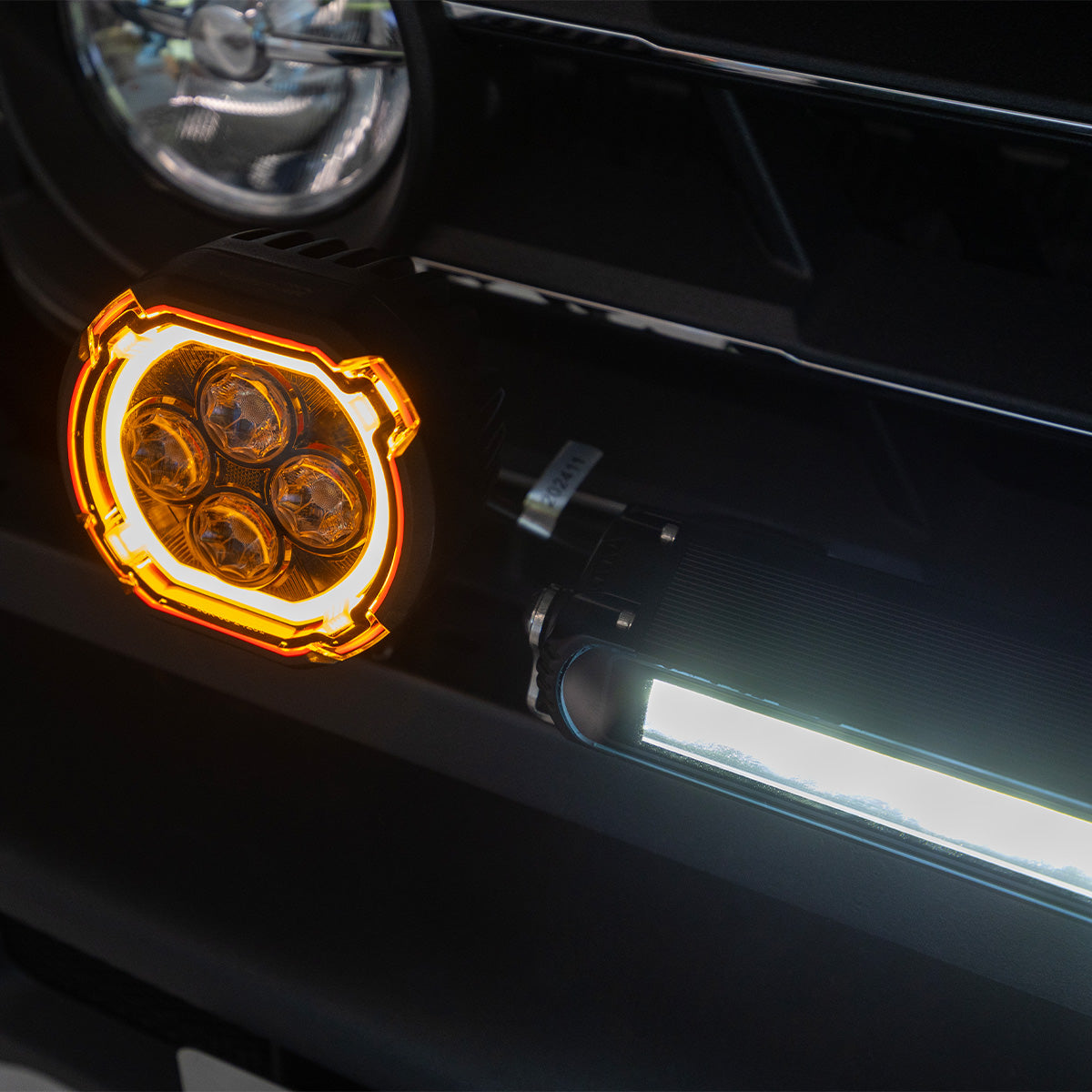 Front view installed square LED pods on Defender