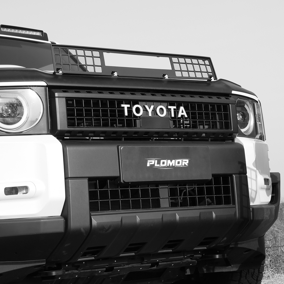 Toyota Land Cruiser LC250 engine bug mesh installed, protecting the engine bay while maintaining a clean factory-style appearance.