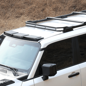 Toyota Land Cruiser LC250 fitted with PLOMOR aluminium front roof frame and integrated LED lights