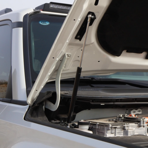 Hydraulic hood struts installed on Toyota Land Cruiser LC250, replacing the factory prop rod for automatic hood lifting