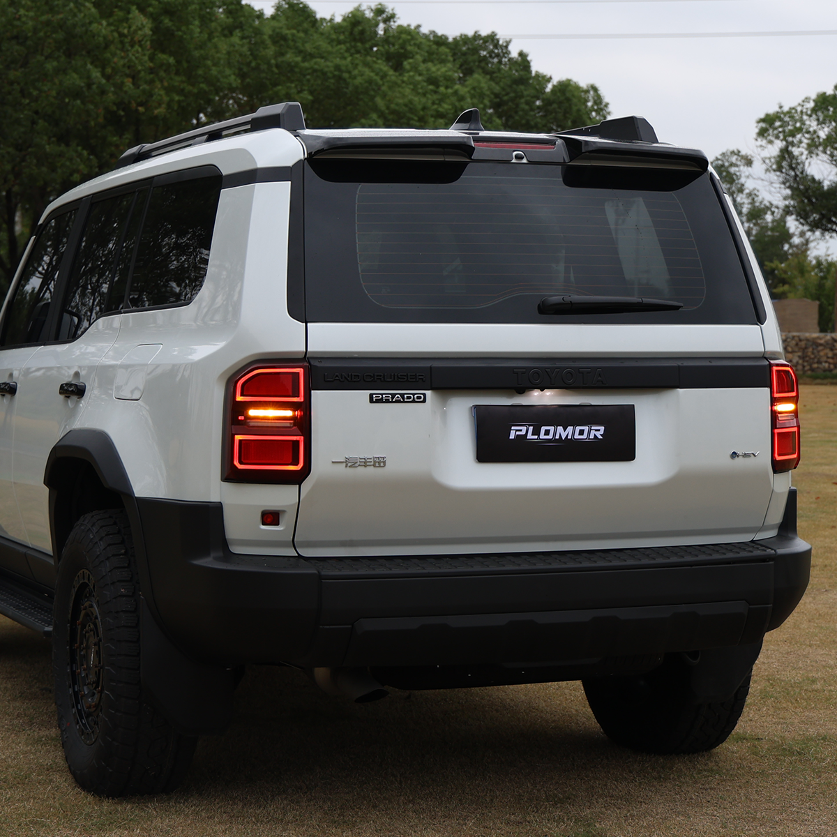 Side view of Toyota LC250 rear spoiler in durable gloss black ABS, custom fit for 2024+ model
