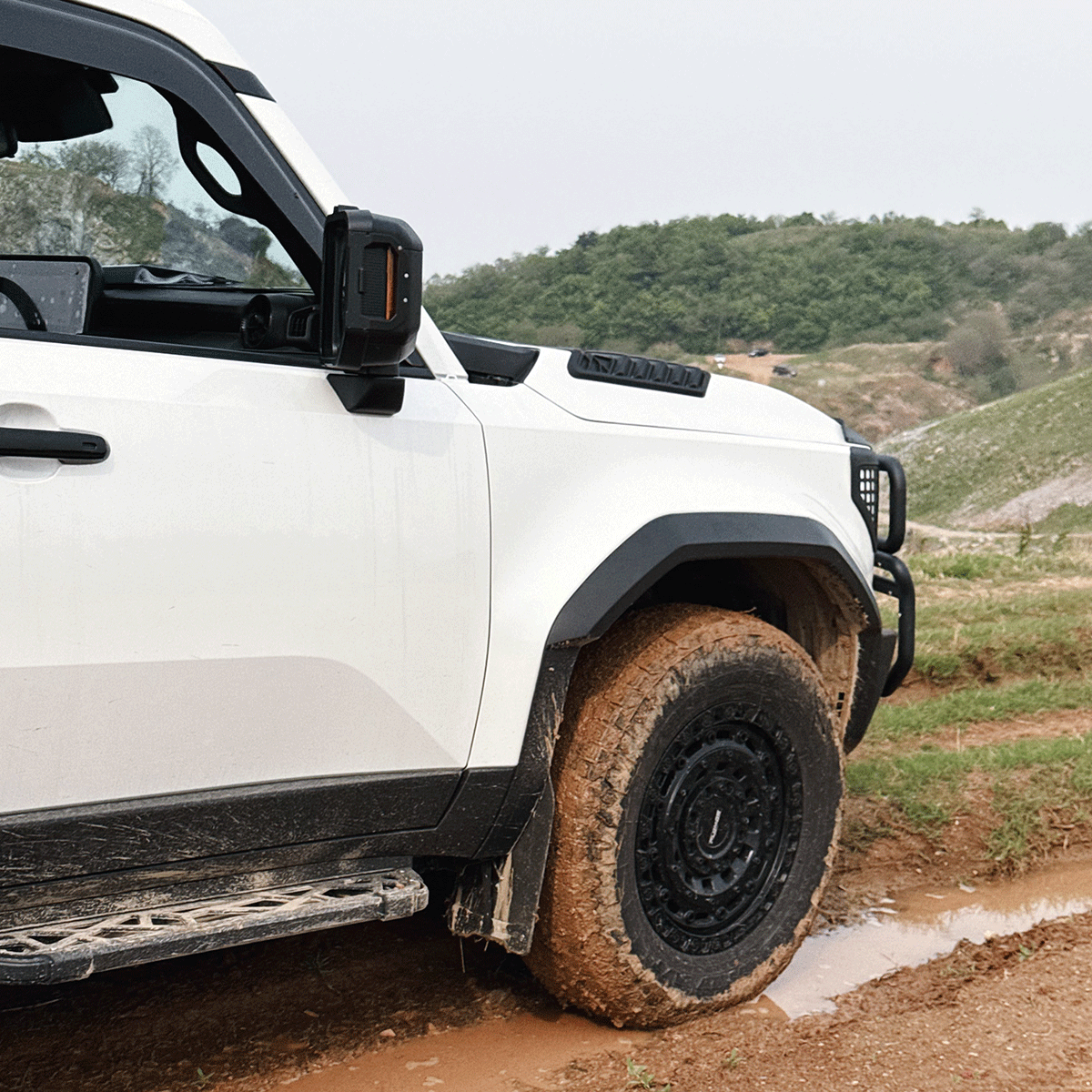 Toyota Land Cruiser LC250 fitted with wide wheel arch flares on the road